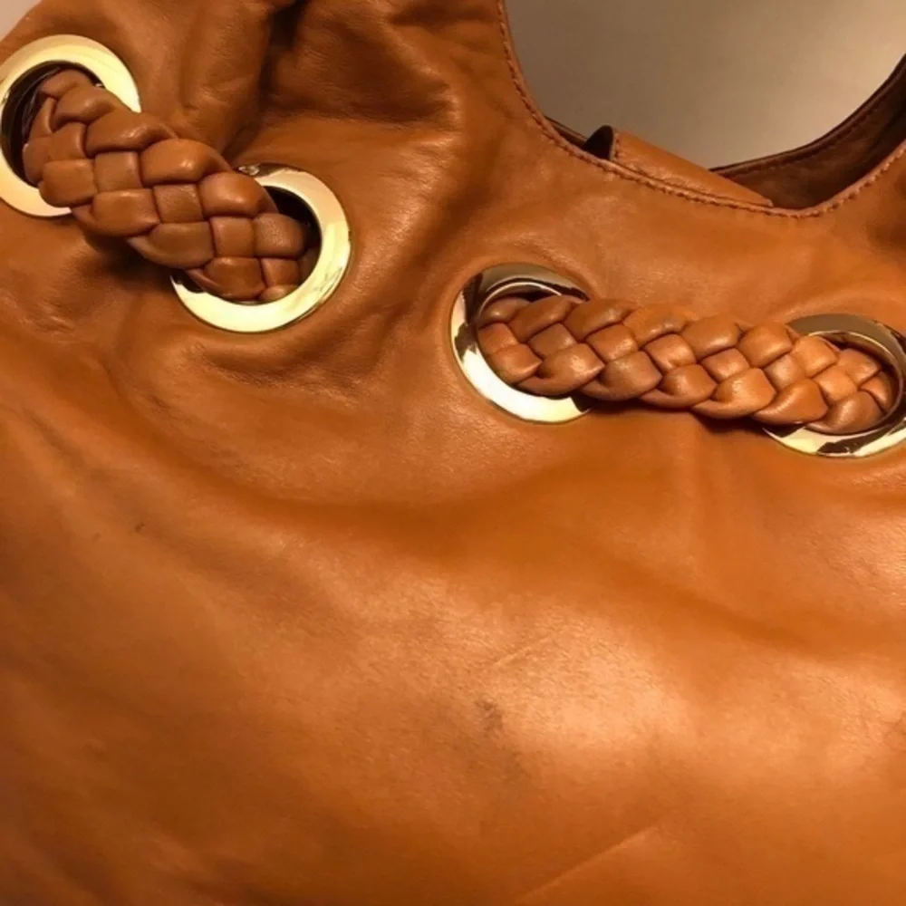 Michael kors brown leather grommet tassel bag